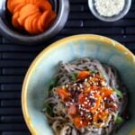 Asian tofu with ginger-carrot glaze on top of noodles.