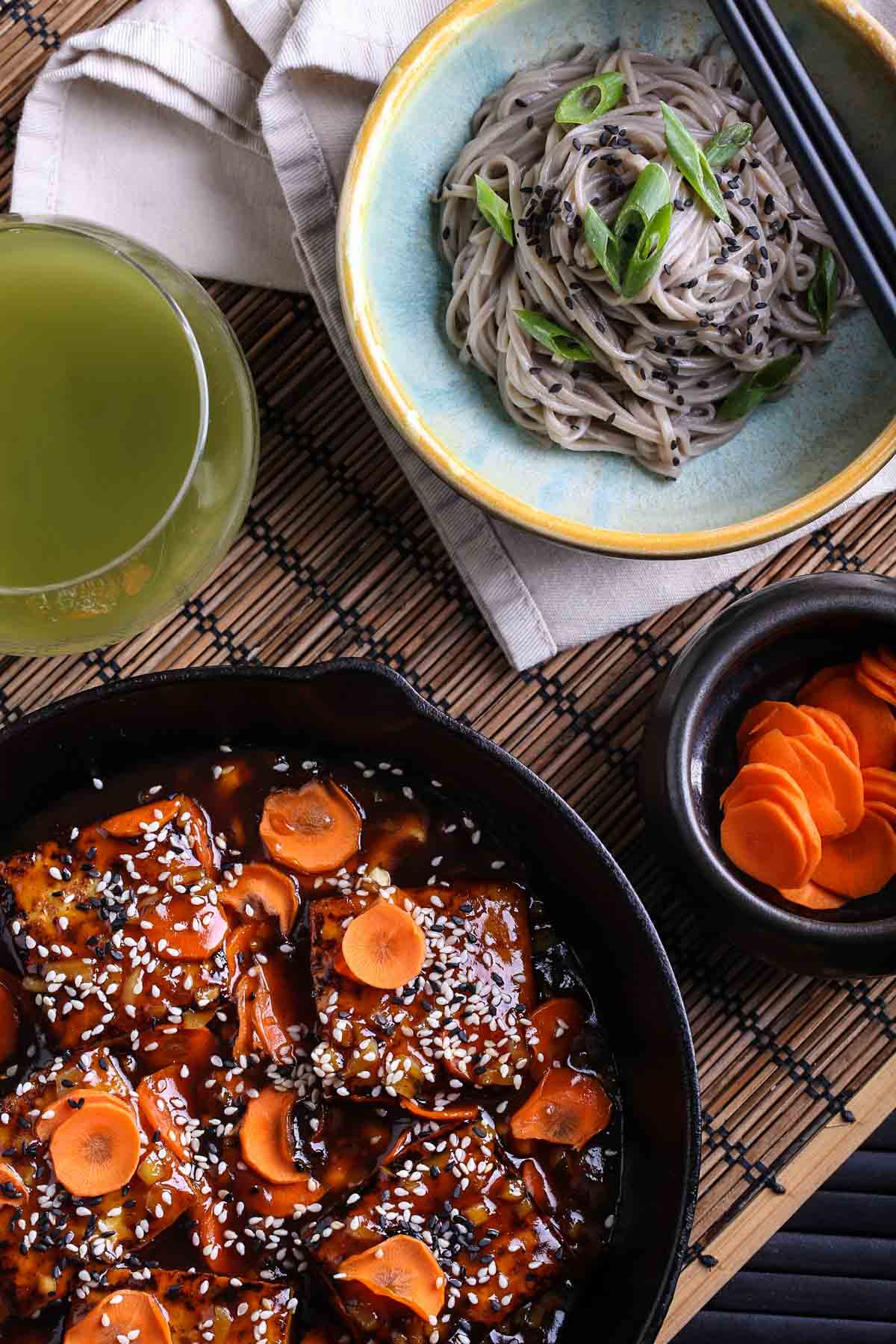 Asian tofu with ginger-carrot glaze with noodles.