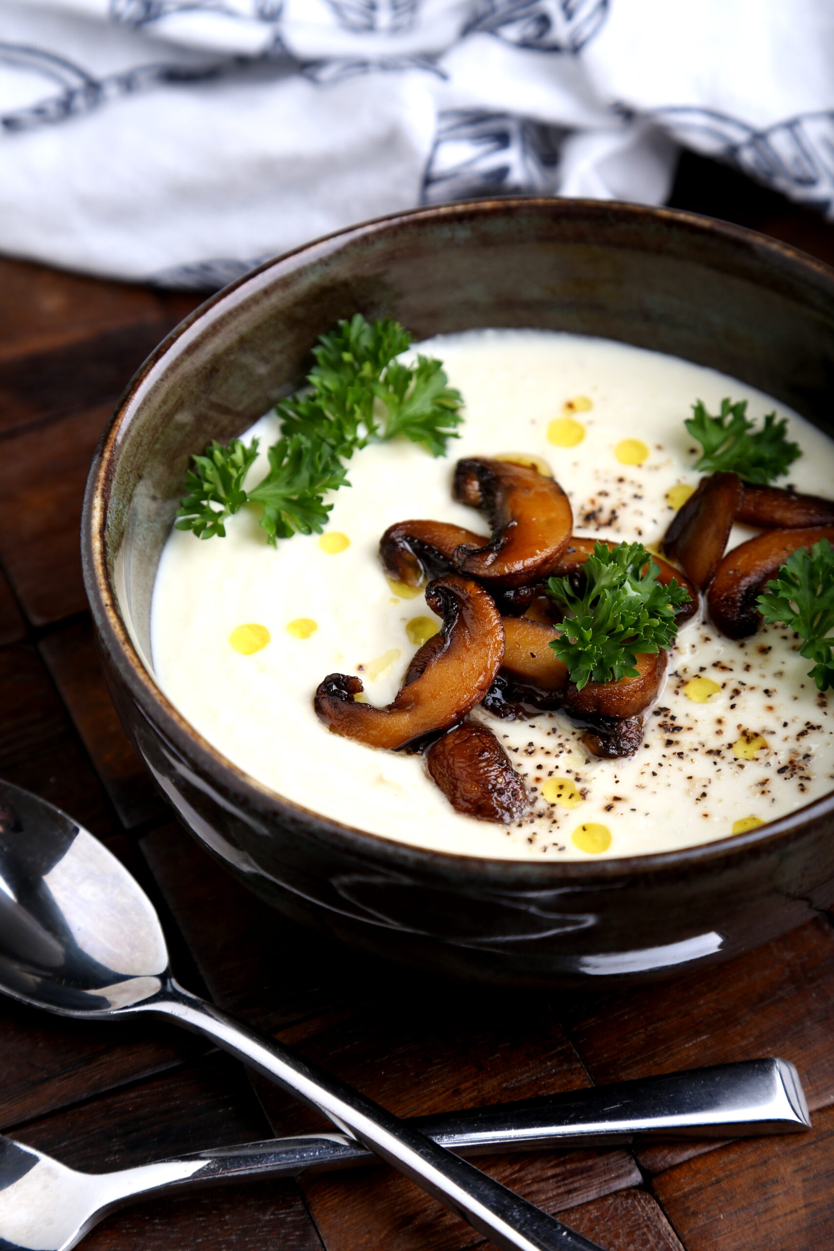 A bowl of cashew and cauliflower soup.