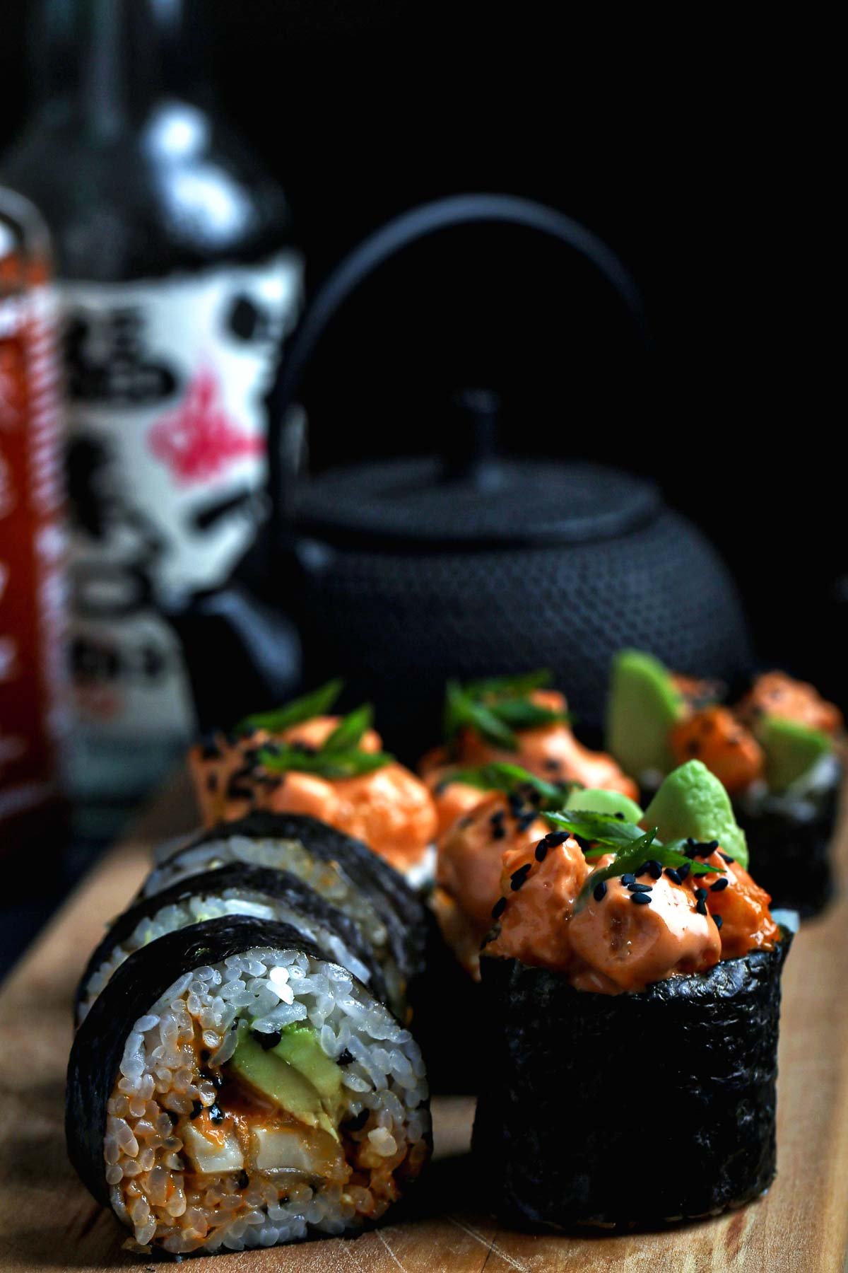 Dynamite sushi roll, cut open to show the interior.