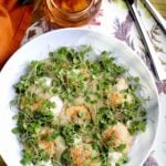 Homemade pumpkin ravioli, garnished with microgreens.