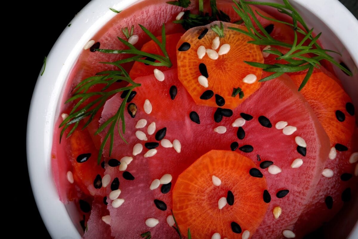 Pickled watermelon radish, garnished with dill.
