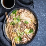 A bowl of Vegan Crab Coconut Thai Soup with chopsticks.