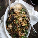 A farro salad in a white bowl.