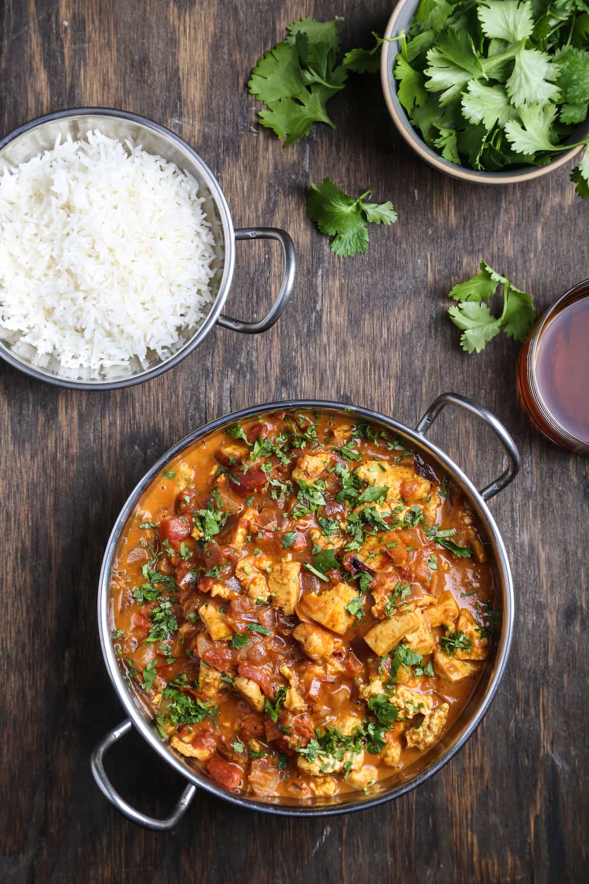 Tofu tikka masala, with rice and cilantro.