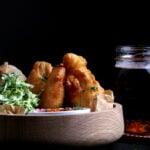 A serving of crispy beer-battered vegan fish.